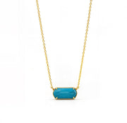 Turquoise pendant necklace featuring a custom-cut gemstone in a gold-plated setting, suspended from an elegant adjustable anchor chain.Turquoise Stone Necklace